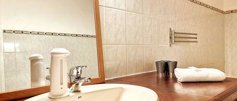 Bathtub, hair dryer, towels