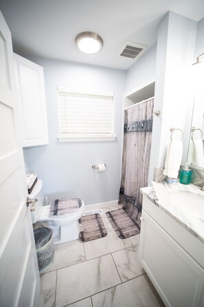 Shower, hair dryer, towels, soap