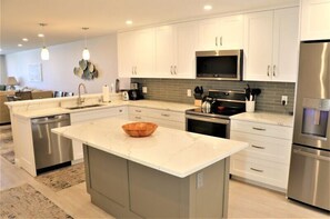 Fridge, coffee/tea maker, cookware/dishes/utensils