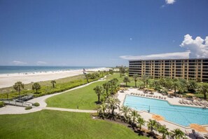 A resort with a swimming pool, beach view, and a large building. - Gulf and Bay Club- A503 Updated with great view! (Siesta Key)