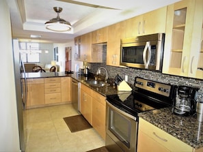 Fridge, coffee/tea maker, cookware/dishes/utensils