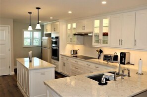 Fridge, coffee/tea maker, cookware/dishes/utensils