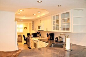 Fridge, coffee/tea maker, cookware/dishes/utensils