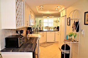 Fridge, coffee/tea maker, cookware/dishes/utensils