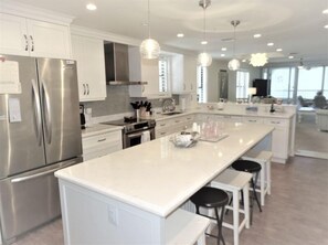 Fridge, coffee/tea maker, cookware/dishes/utensils