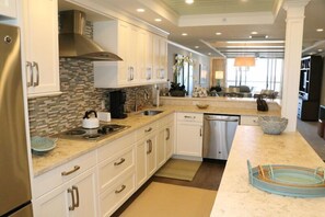 Fridge, coffee/tea maker, cookware/dishes/utensils
