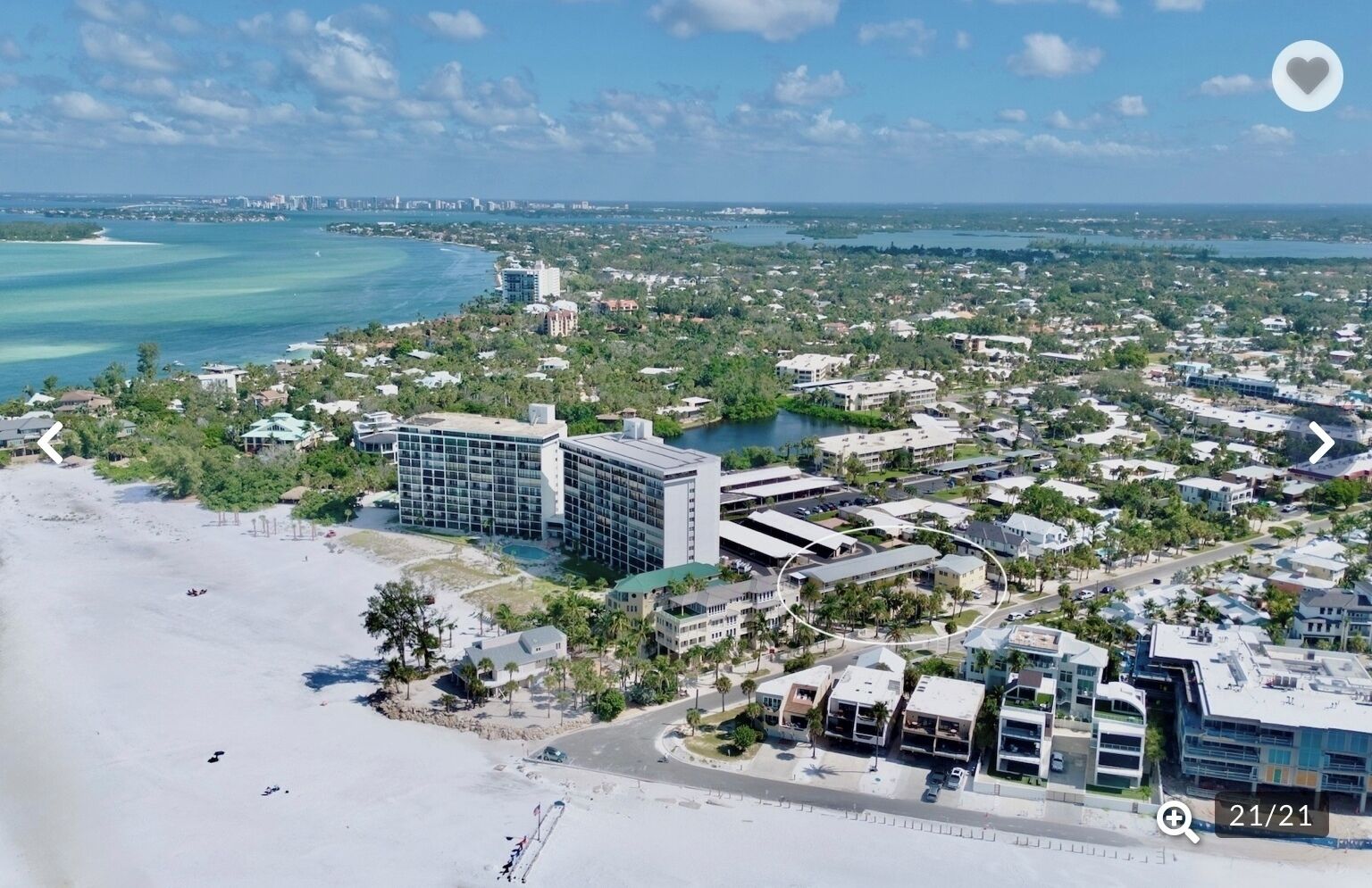 Stunning beachfront property offers direct beach access and panoramic coastal views in this vibrant waterfront community.