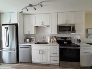 Fridge, dishwasher, coffee/tea maker, toaster