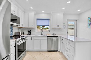 Fridge, dishwasher, coffee/tea maker, toaster