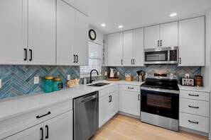 Fridge, dishwasher, coffee/tea maker, toaster