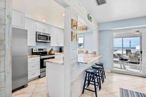 Fridge, microwave, oven, stovetop - Jamaica Royale 205: Spacious Beach Condo with Coastal Charm and Shared Amenities (Siesta Key)