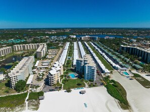 Experience the luxury of a central courtyard with a swimming pool, smaller pools, and a well-maintained lawn area.