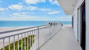 A balcony with a view of the beach and ocean. - Couples Beachfront Getaway at Jamaica Royale 801 in Siesta Key! (Siesta Key)