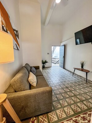Classic Apartment | Living area | 50-inch Smart TV with digital channels, TV - Nando's Place (San Juan)