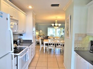 Enjoy cooking in this well-equipped kitchen with a central island and modern appliances.