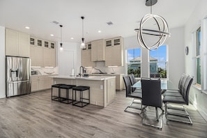 Fridge, microwave, oven, stovetop - Three-story, beach home with decks & partial Gulf view (Galveston)