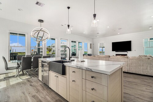 Three-story, beach home with decks & partial Gulf view