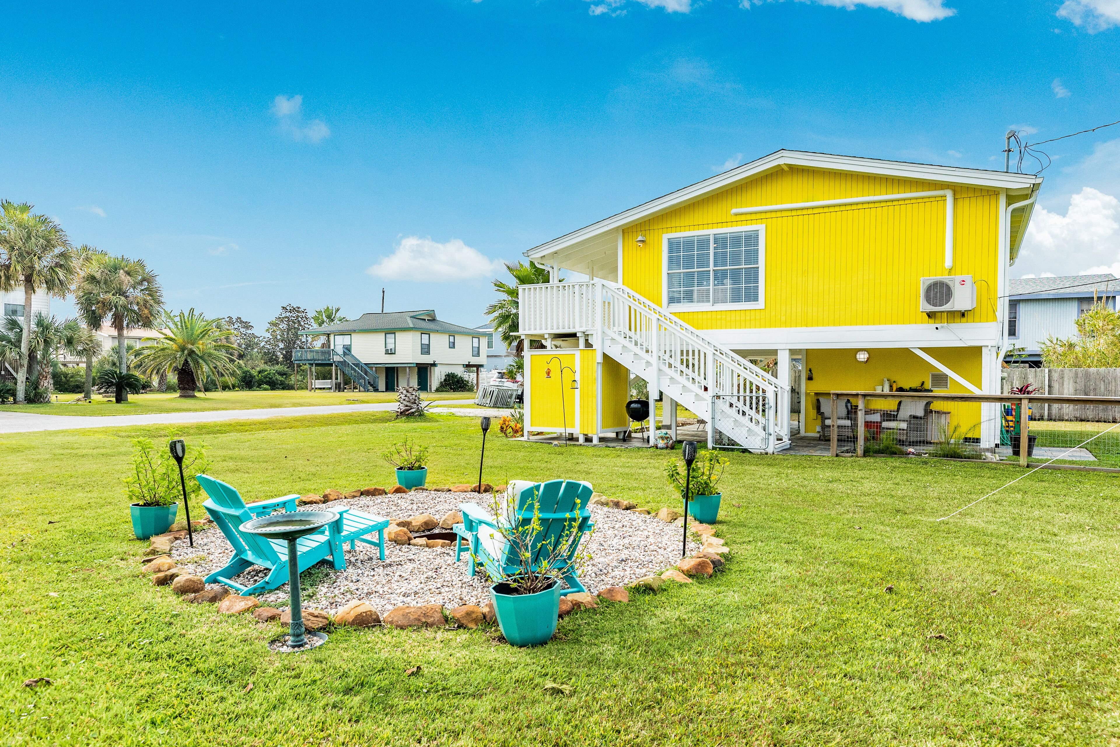Dog-friendly vibrant home with entertainment systems, fireplaces, & shared pool