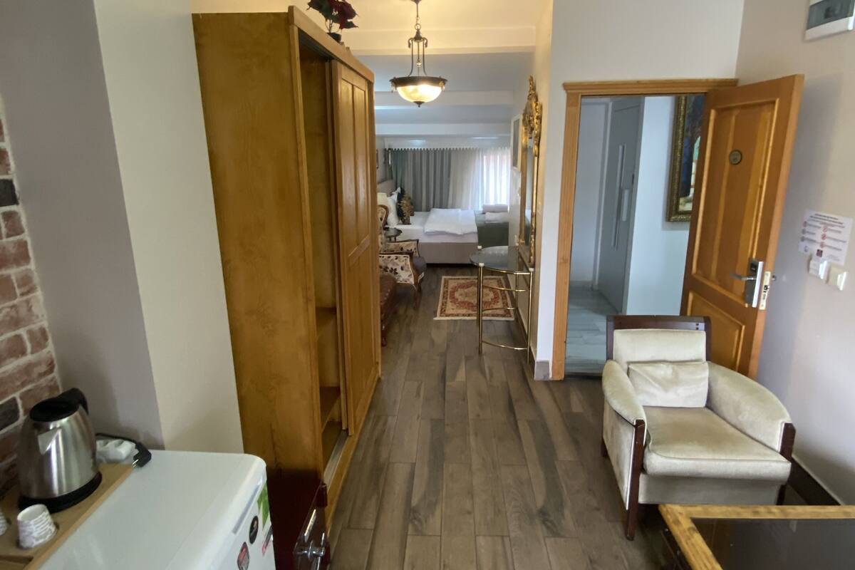 Family Quadruple Room | In-room safe, iron/ironing board, free WiFi, bed sheets