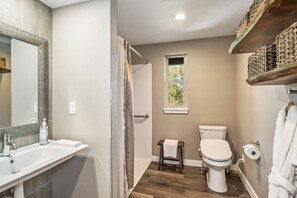Shower, hair dryer, towels, shampoo