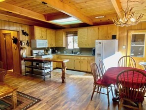 Full-sized fridge, cookware/dishes/utensils, spices