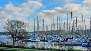A marina with numerous sailboats docked. - La Maison de Louise - Ferel (FEREL)