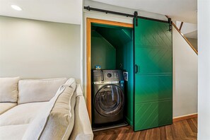In-Unit Washer & Dryer - Convenient in-unit washer and dryer tucked neatly behind sliding doors, perfect for longer stays and refreshing gear after outdoor adventures.