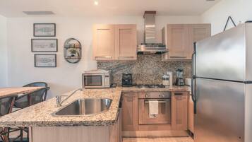 Fridge, oven, coffee/tea maker, cookware/dishes/utensils