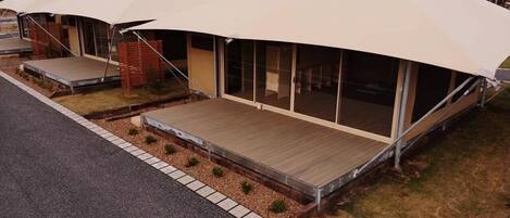 A modern building with a flat roof and large windows.