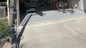 A residential garage with a basketball hoop, a pool table, and a bicycle. - Single home  with 5 bedrooms  sleep 10 at  a corner lot, fully garage to use (Pflugerville)