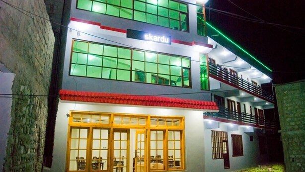 A multi-story building with a sign reading "skardu" at the top. - Skardu Royal Hotel and Restaurant (Skardu)