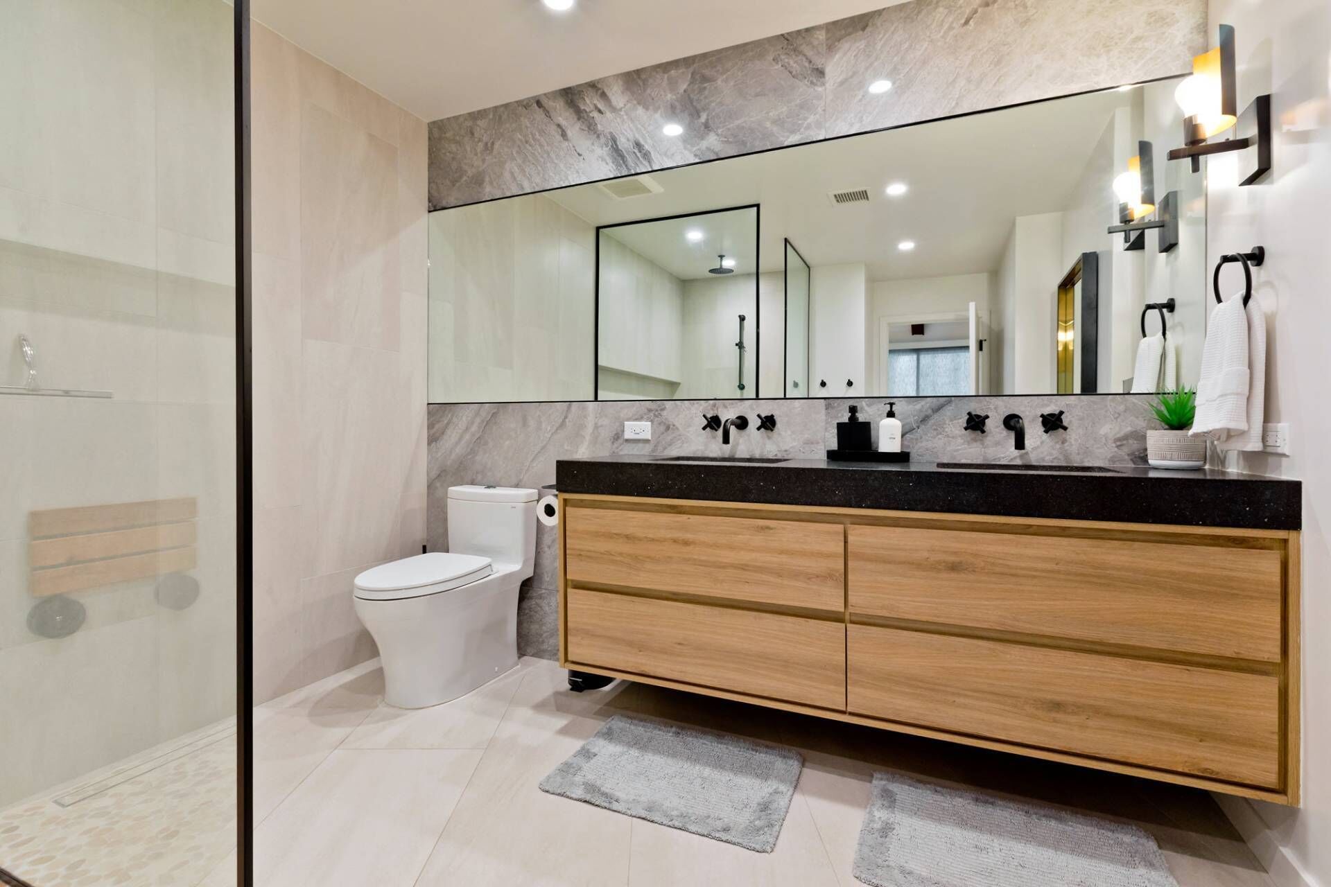 Shower, hair dryer, towels, shampoo