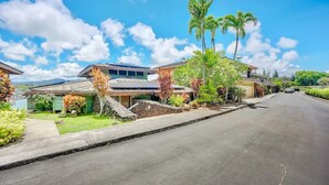 A residential street with houses, palm trees, and a clear sky. - Direct Oceanfront Kalapaki Beach Home, Wrap-Around Lanai, A/C, Views, Sleeps 8 (Lihue)