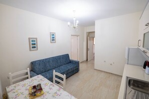 Two-Bedroom Apartment | Living area | 32-inch plasma TV with cable channels, TV - Sunny Holiday (Sarandë)