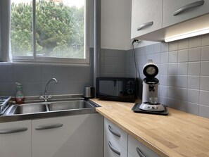 Fridge, microwave, stovetop, coffee/tea maker