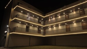 A multi-story building with balconies and a flat roof. - The Presidential Suites (Bhuj)