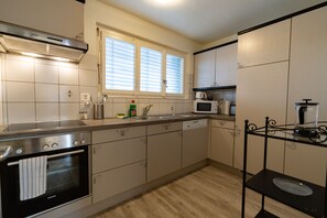 Standard Apartment, 2 Bedrooms, Balcony, Mountain View | Private kitchen | Fridge, microwave, oven, stovetop