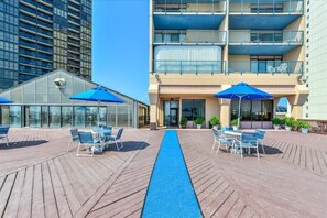 Relax on the rooftop terrace with comfortable seating and umbrellas.
