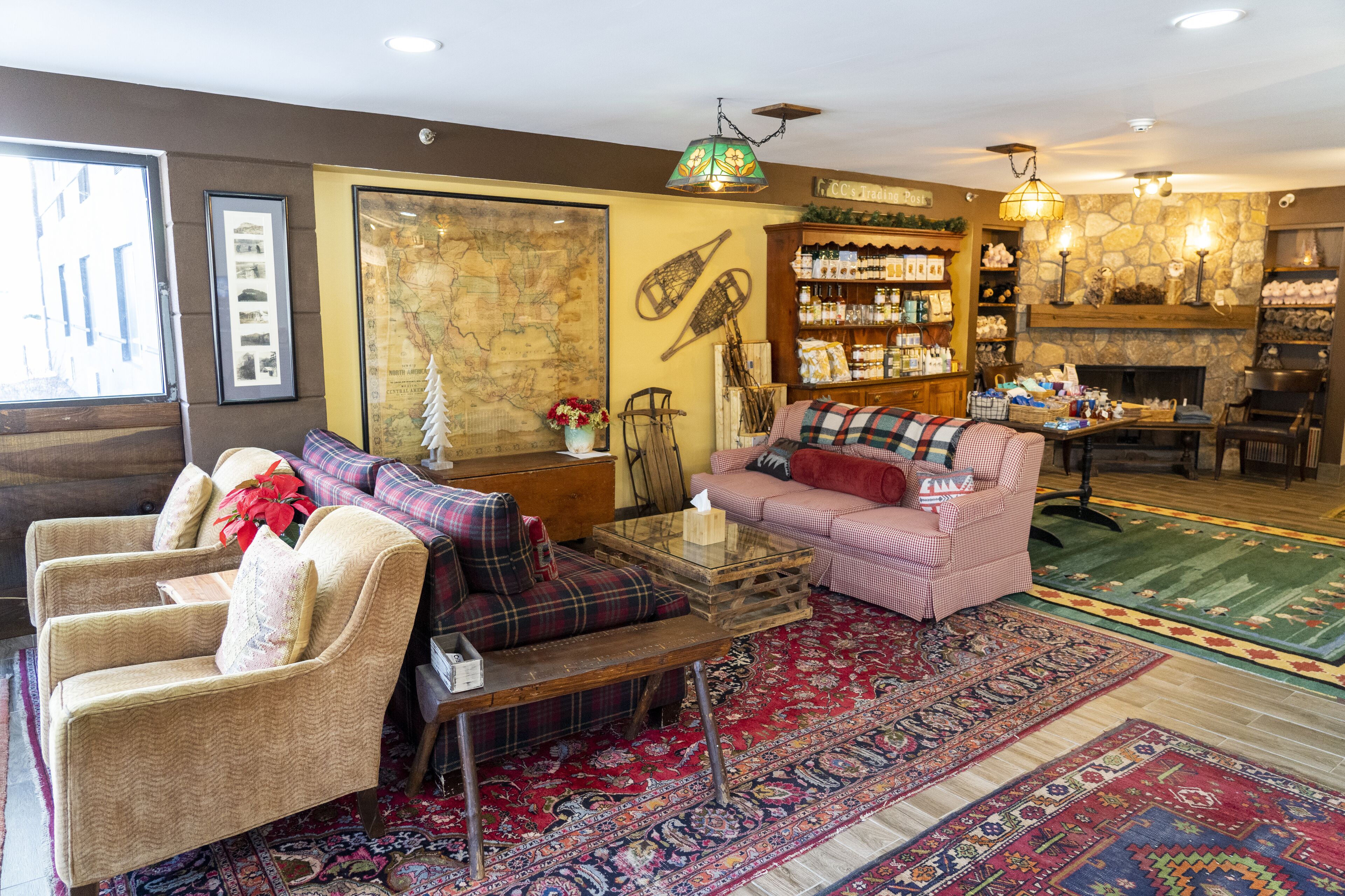 A cozy living room with a fireplace, a coffee table, and a sofa.