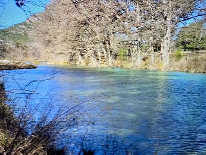 Private Riverside Cabin in Concan ~ Gated, Cowboy Chic, Beautiful Riverfront!