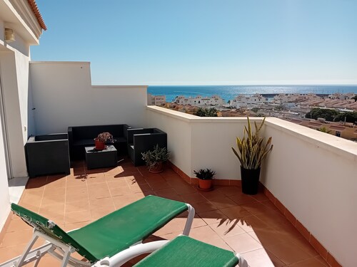 Penthouse next to the Romanilla Beach, dream terrace