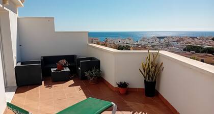 Penthouse next to the Romanilla Beach, dream terrace