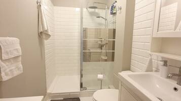 Shower, hair dryer, towels, soap