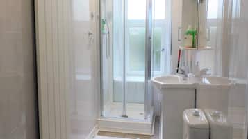 Shower, hair dryer, towels, shampoo