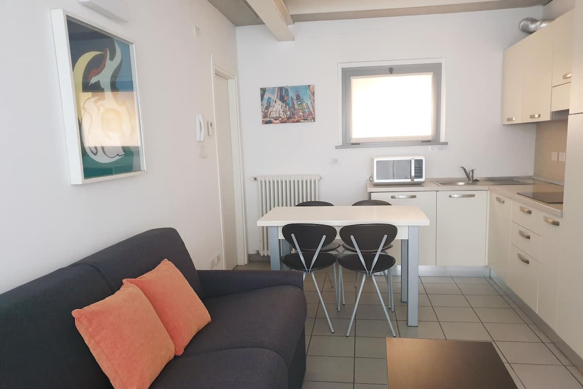 Apartamento básico, 1 quarto | Área de estar