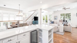 A spacious kitchen with white cabinetry, a built-in refrigerator, and a large island. - 1 Minute Stroll to Gulf with Private Heated Pool, Bikes, and a Gulf View (Santa Rosa Beach)