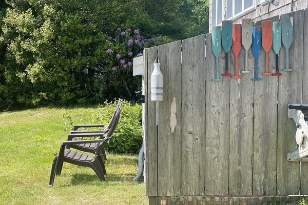 amazing outdoor shower with bathing suits or towels hanger on the side.