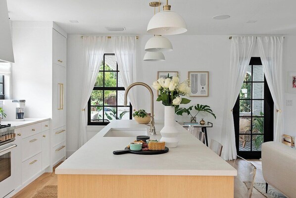 Fridge, microwave, oven, stovetop - The Lotus House · The Lotus House | Palm Beach Luxury Resort Living (West Palm Beach)