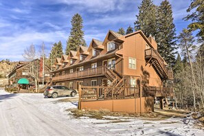 A large wooden building with multiple balconies and a sign reading "The Rapids Condominiums." - 3 Mi to National Park: Cozy Studio in Grand Lake (Grand Lake)