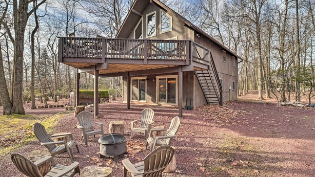 A cabin with a deck, outdoor seating, and a fire pit. - Lake Harmony Access: Home w/ Game Room + Fire Pit! (Lake Harmony)